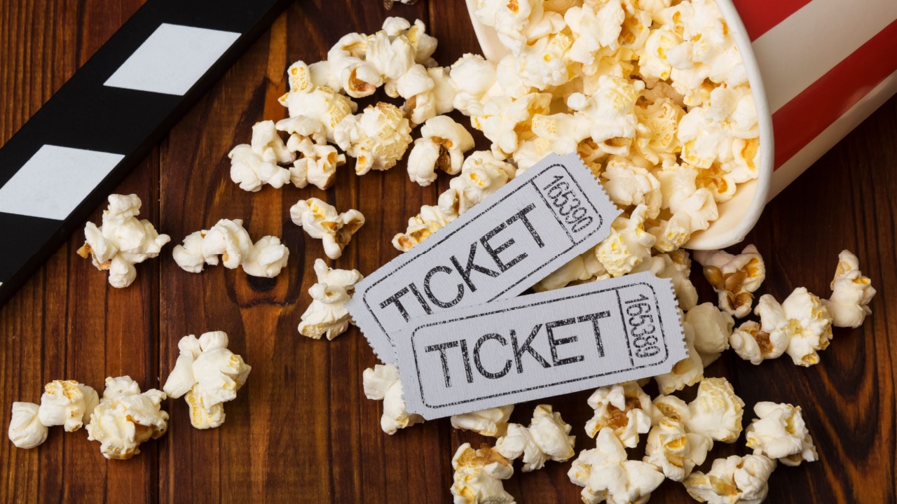 Movie tickets with popcorn and 3d glasses