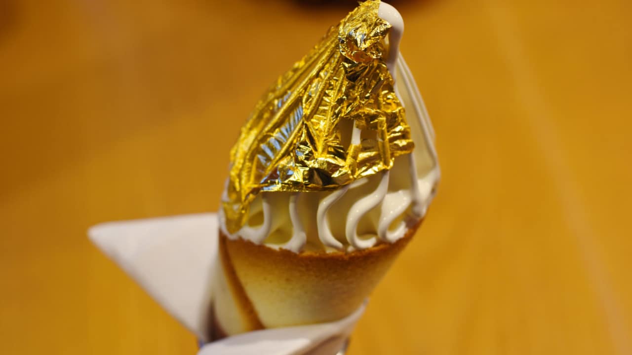Vanilla ice cream decorated in gold leaf
