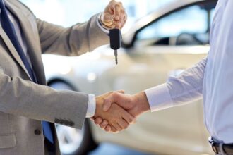 car keys shaking hands salesman